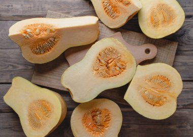 Big red pumpkin background, copy space, Orange  pumpkin , close-up.Pumpkin .Cooking seasonal food from pumpkin. Delicious healthy food. Organic.Autumn.Winter. Vitamins. Diet. Slimming. 