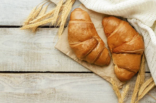 French cuisine, homemade bakery, breakfast, food, cooking and pastry concept. Morning with fresh croissants. fresh croissants on table, dessert. croissants and hot drink.