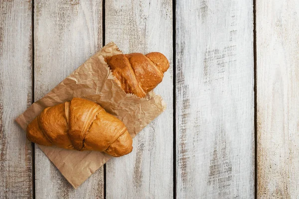 Breakfast with tea and croissants. freshly baked croissant. concept production of croissants. Freshly Buttery baked croissants. French and American Croissants and Baked Pastries are enjoyed worldwide.