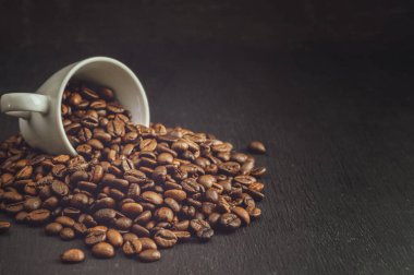 Background of roasted coffee beans. Coffee shop concept.Coffee beans, food background and texture from freshly roasted coffee beans, top view banner.
