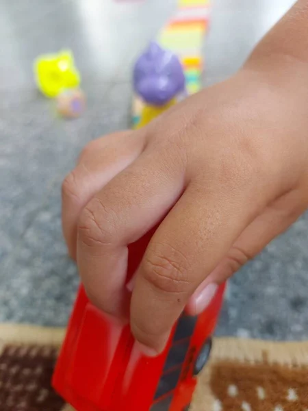 Close Child Playing Terrace House His Hand Holding His Toy — Stock Photo, Image