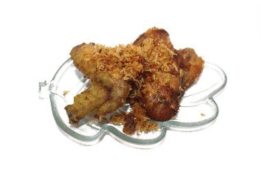 Coconut shredded fried chicken wing or sayap ayam goreng serundeng (in Indonesia). Indonesian tradisional food.