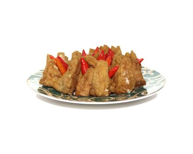 Tahu Bakso is a traditional snack made from tofu, glutinous rice powder and beef. served in bowl with sambal and green chilli. white background. Suitable for takjil in Ramadhan. Selective focus.