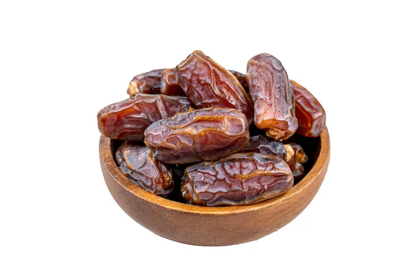 ahşap masa arka plan üzerinde fincan hurma meyve yakın resim. Hurma meyve kuru snack sağlıklı.