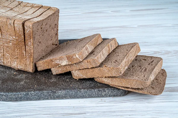 stock image Gluten-free rectangular bread loaves. It is made with buckwheat flour, black cumin powder, gluten-free baking powder, water and salt. Gluten free food.