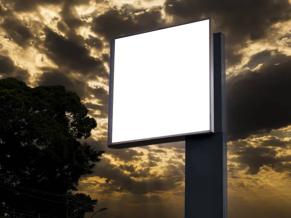 Digital Media blank advertising billboard with sunset sky in background. Blank billboards public commercial with passengers, signboard for product advertisement design.