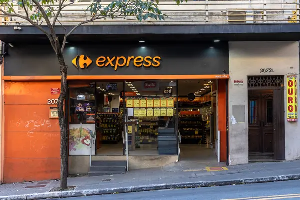 Stock image Sao Paulo, Brazil, May 18, 2024. View of facade of Carrefour Express store and gold buy store in Augusta street, downtown Sao Paulo