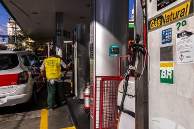 Sao Paulo,  SP, Brazil, March 30 ,2017. Taxi refueling with natural gas (CNG) on the gas station in Sao Paulo city. Alternative fuel, sustainability, transportation cost.
