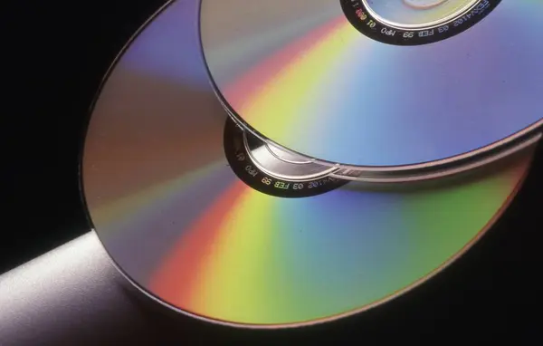 close up shot of a compact disc on black background