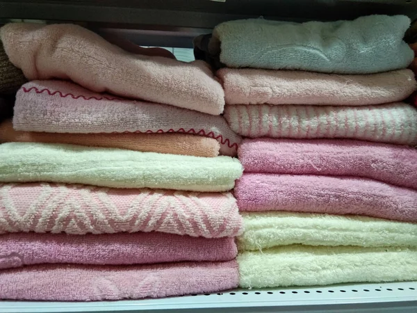 pile of towels of various colors at a home improvement store