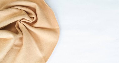 beige sweater fabric with white background negative space area