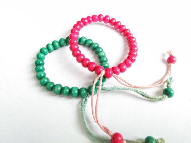 plastic beaded bracelets are round in shape and united by thread