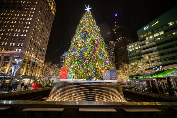 stock image Christmas Tree at Campus Martius Park at night in downtown Detroit, Michigan at Christmastime. Taken at night on a rainy day.  A giant Christmas Tree is on top of the park fountain. The lights on the tree can be seen.