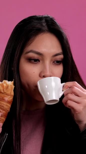 Young Woman Eats Freshly Baked French Croissant Studio Shooting — Stock Video