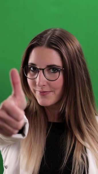 Young Pretty Woman Makes Thumbs Gesture Studio Photography Vertical Video — Vídeos de Stock