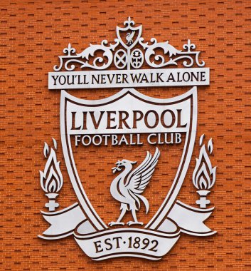 FC Liverpool Logo on the wall of Anfield stadium - LIVERPOOL, UNITED KINGDOM - AUGUST 16, 2022