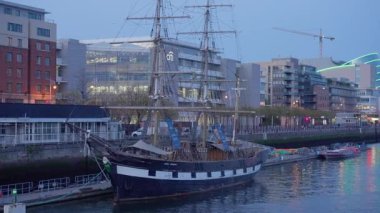 Old sailing boat on River Liffey in Dublin - CITY OF DUBLIN, IRELAND - APRIL 20, 2022