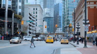 Street view in Gastown - the historic district of Vancouver - CITY OF VANCOUVER, CANADA - APRIL 12, 2017