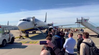 Passengers entering a Ryanair Airplane at Frankfurt Hahn Airport HHN - HAHN, GERMANY - APRIL 20, 2022