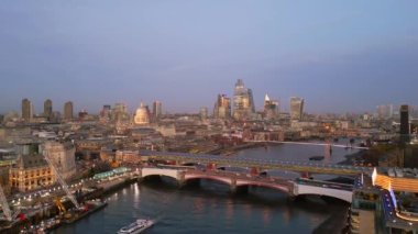 City of London and River Thames in the evening - aerial view - LONDON, UNITED KINGDOM - DECEMBER 18, 2022