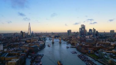 Aerial view over Tower Bridge and the city of London - LONDON, UNITED KINGDOM - DECEMBER 18, 2022