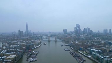 London and Tower Bridge over River Thames on a foggy day - LONDON, UNITED KINGDOM - DECEMBER 18, 2022