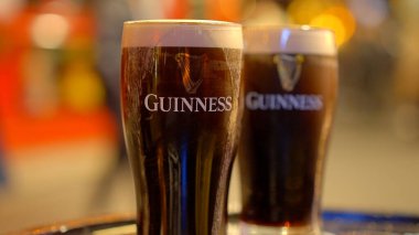 Fresh cold Guinness beer at an Irish Pub in Dublin - CITY OF DUBLIN, IRELAND - APRIL 20, 2022