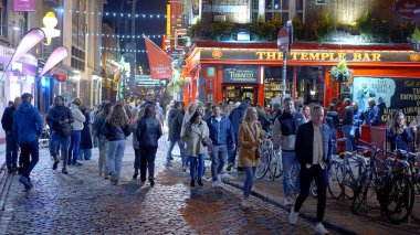 Temple Bar district in Dublin is a crowded place - CITY OF DUBLIN, IRELAND - APRIL 20, 2022