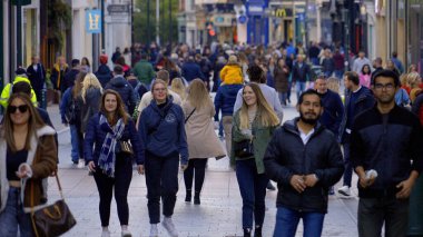 People in Grafton Street Pedestrian zone in Dublin - CITY OF DUBLIN, IRELAND - APRIL 20, 2022