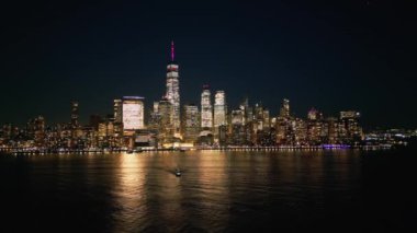 Flying along the waterfront of Manhattan New York City at night - drone photography