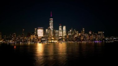 Aerial view over the skyline of Manhattan New York City at night - NEW YORK, UNITED STATES - FEBRUARY 15, 2023