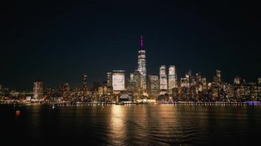 Aerial view over the skyline of Manhattan New York City at night - drone photography