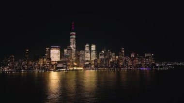 Aerial view over the skyline of Manhattan New York City at night - drone photography