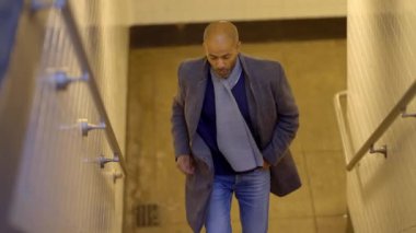 Man leaving a subway station in New York - travel photography