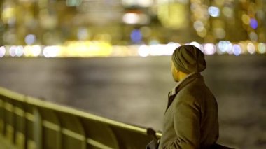 Man standing at the waterfront with Manhattan skyline - travel photography