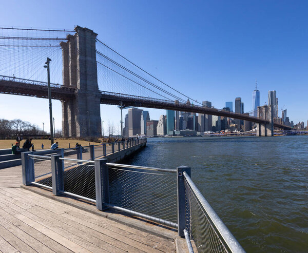 View over Brooklyn Bridge from Brooklyn Bridge Park - NEW YORK, UNITED STATES - FEBRUARY 14, 2023