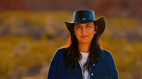 Portrait shot of a cowgirl in the desert at sunset - travel photography