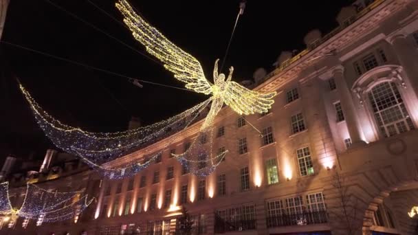 ロンドンのリージェンシーストリートの素晴らしい天使 美しいクリスマスの装飾 ロンドン ユニットキンダム December 2023 — ストック動画