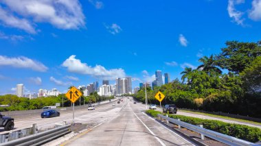 Driving on Rickenbacker Causeway towards Miami - MIAMI, FLORIDA - NOVEMBER 5, 2024 clipart