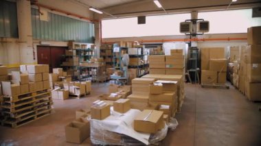 COSSATO, ITALY, JULY 7, 2023: Production of cosmetics. Cosmetic manufacturing process. Automatic packaging of cosmetics. Cosmetic factory. Warehouse of chemical products. Packaging. Empty cartons