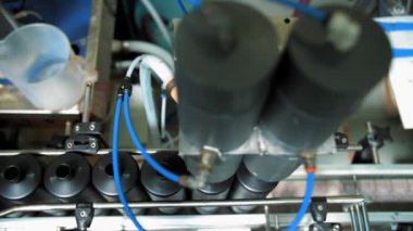 Empty plastic containers, tubes. Plastic tubes are filled with hair dye and sealed with special automatic equipment in a chemical factory.