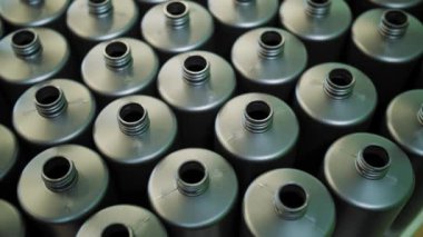 Empty plastic containers, tubes. Plastic tubes are filled with hair dye and sealed with special automatic equipment in a chemical factory.