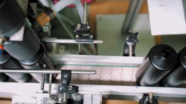 Empty plastic containers, tubes. Plastic tubes are filled with hair dye and sealed with special automatic equipment in a chemical factory.