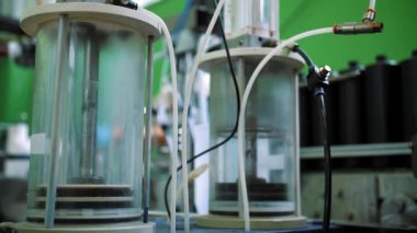 Empty plastic containers, tubes. Plastic tubes are filled with hair dye and sealed with special automatic equipment in a chemical factory.