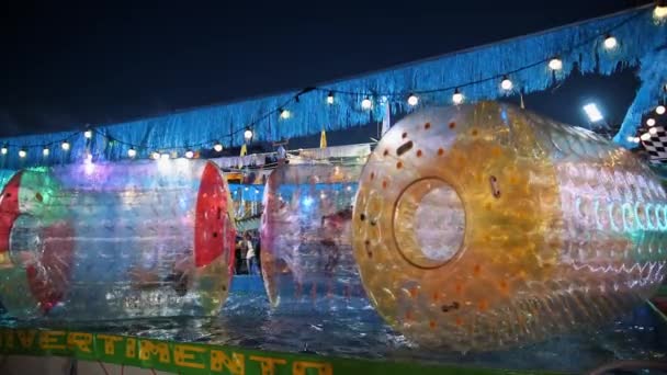 Inflatable Water Rollers Fun Fair Night Water Attractions Flashing Light — Stock Video