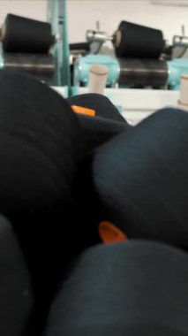 Close-up spools of yarn thread. Threads production. Yarn making processes. Spinning production. Textile factory equipment. Textile factory.