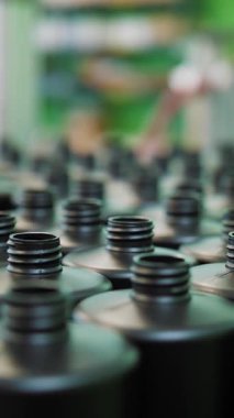 Empty plastic containers, tubes. Plastic tubes are filled with hair dye and sealed with special automatic equipment in a chemical factory.