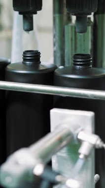 Empty plastic containers, tubes. Plastic tubes are filled with hair dye and sealed with special automatic equipment in a chemical factory.