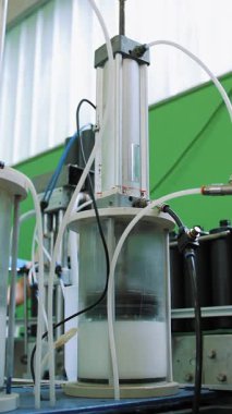 Empty plastic containers, tubes. Plastic tubes are filled with hair dye and sealed with special automatic equipment in a chemical factory.