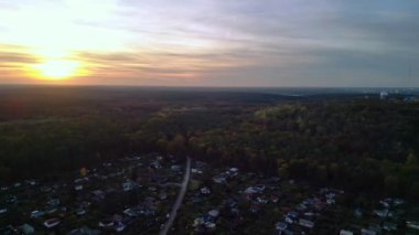 Magic panorama overview drone Allotment gardens berlin teufelsberg, autumn evening sunset 2022. High Quality 4k Cinematic footage